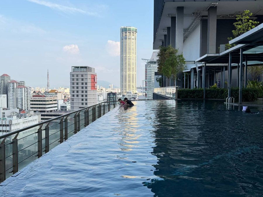 Rooftop infinity pool at Tropicana 218 with KOMTAR in the distance